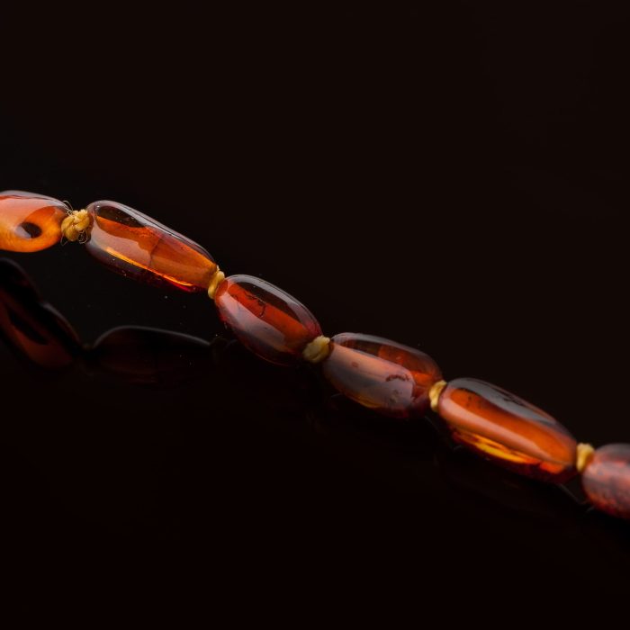 DS_0107-min Amber Baby Teething Necklace - Olive Shape Beads BN013 - Image 2